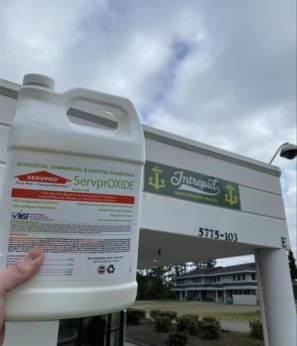 ServprOXIDE bottle in front of a building