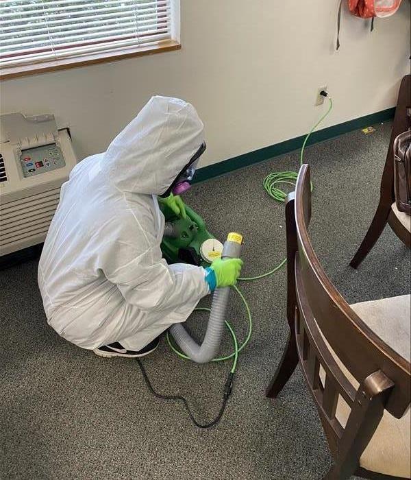 Worker using a fog machine