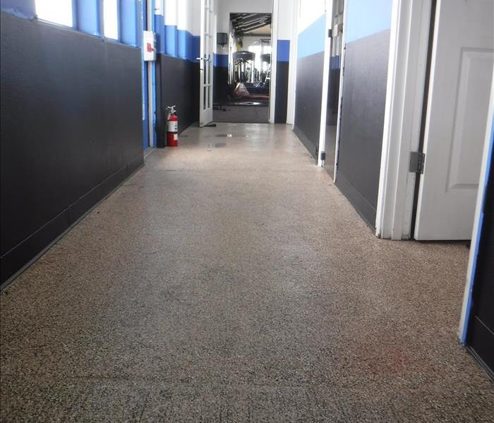 Hallway with blue and black painted walls