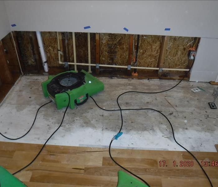 Green air mover, removed drywall